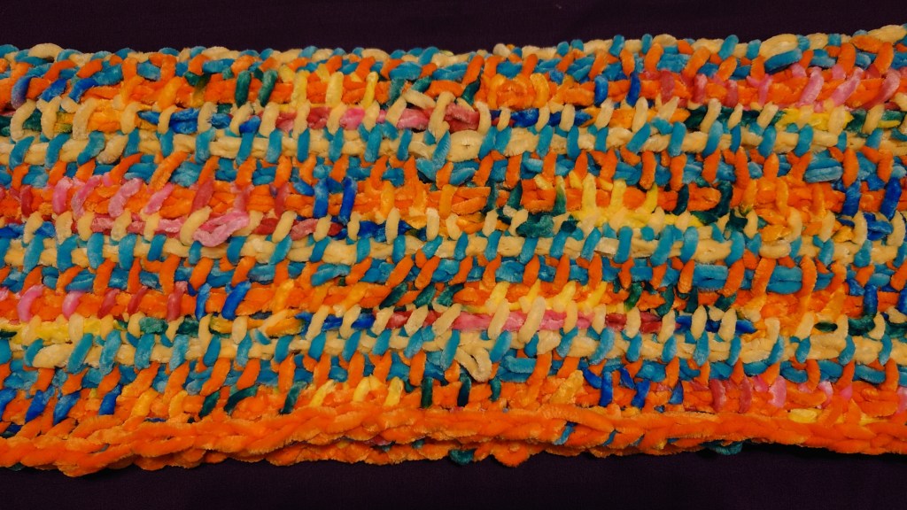 Close-up of a chenille shrug in Tunisian Simple stitch.  My tension is terrible so the stitches are a mess, but the concept proved to be sound.